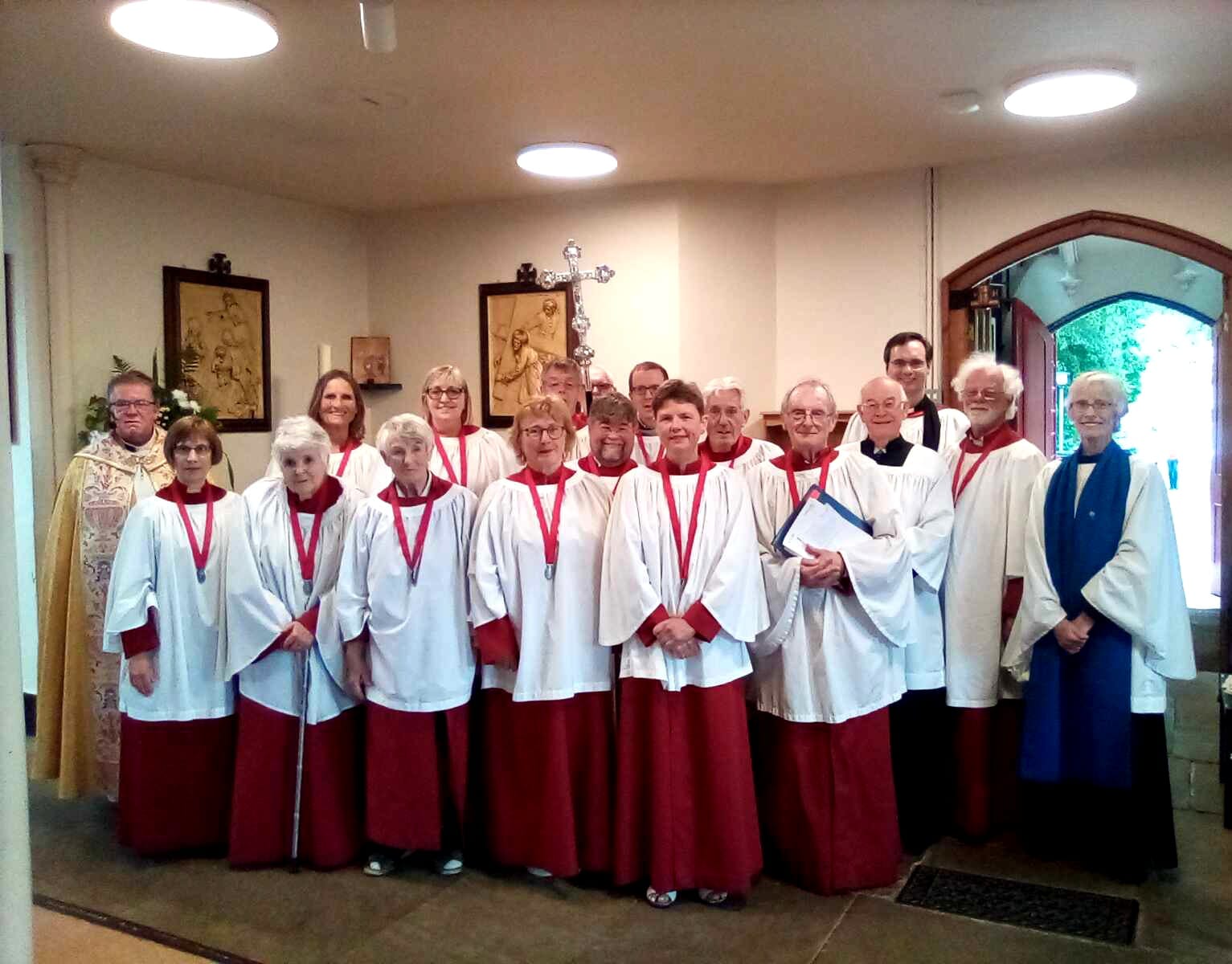 Christ Church Choir members in their red robes and white surplices