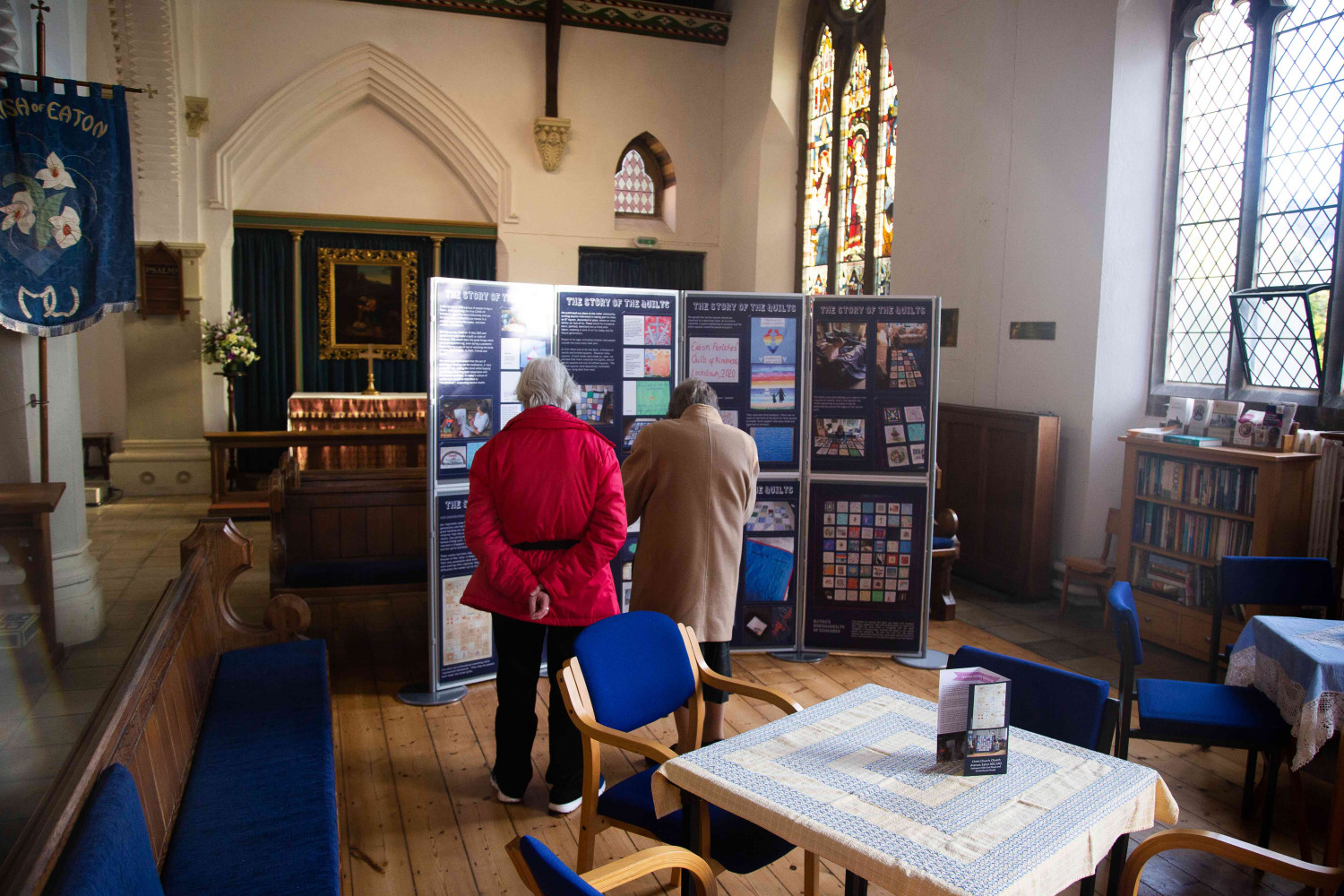 People looking at an information board