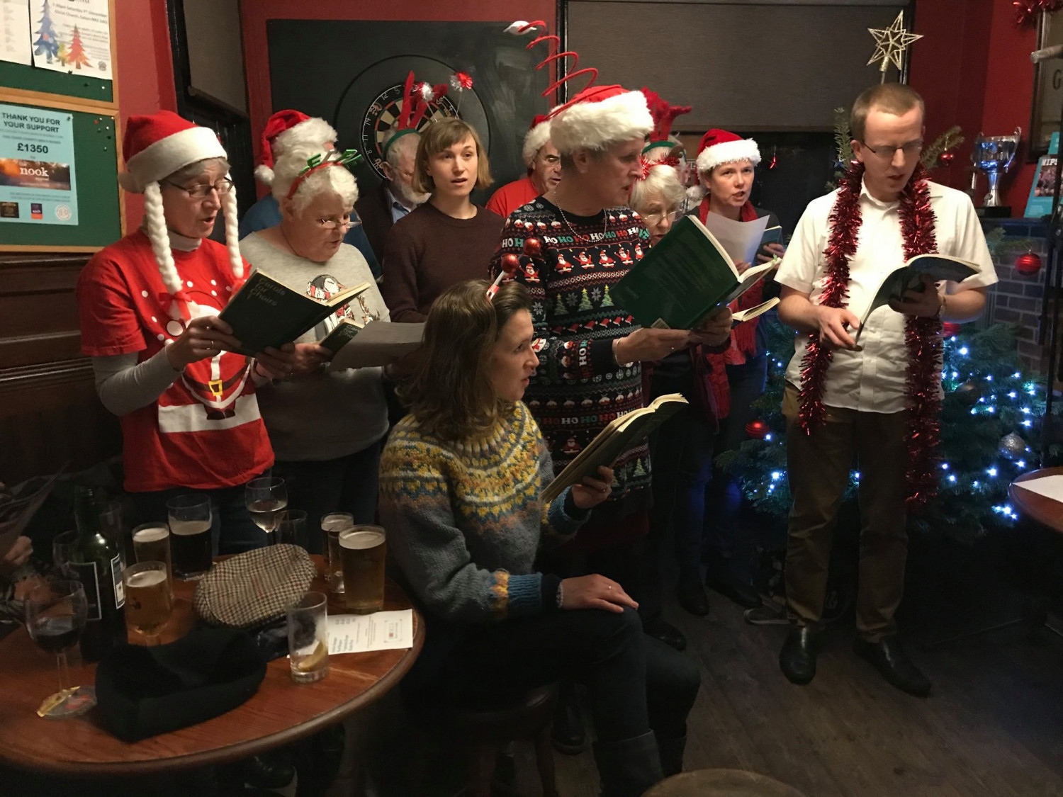 Christ Church choir lead carol singing at The Beehive